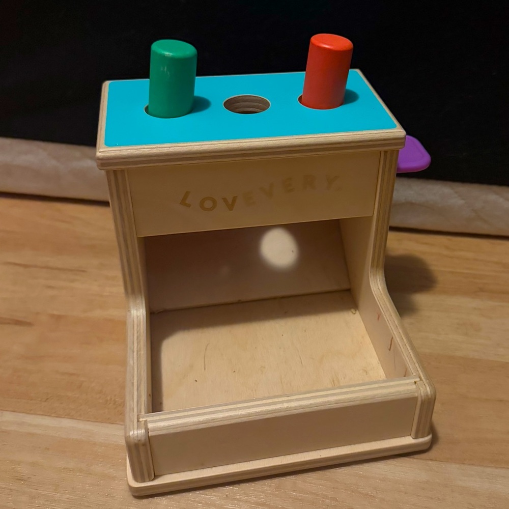 Lovevery Wooden Toy with Green and Orange Pegs